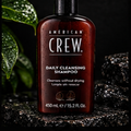 American Crew Daily Cleansing Shampoo 15.2 oz on Groom Standard dark stone background