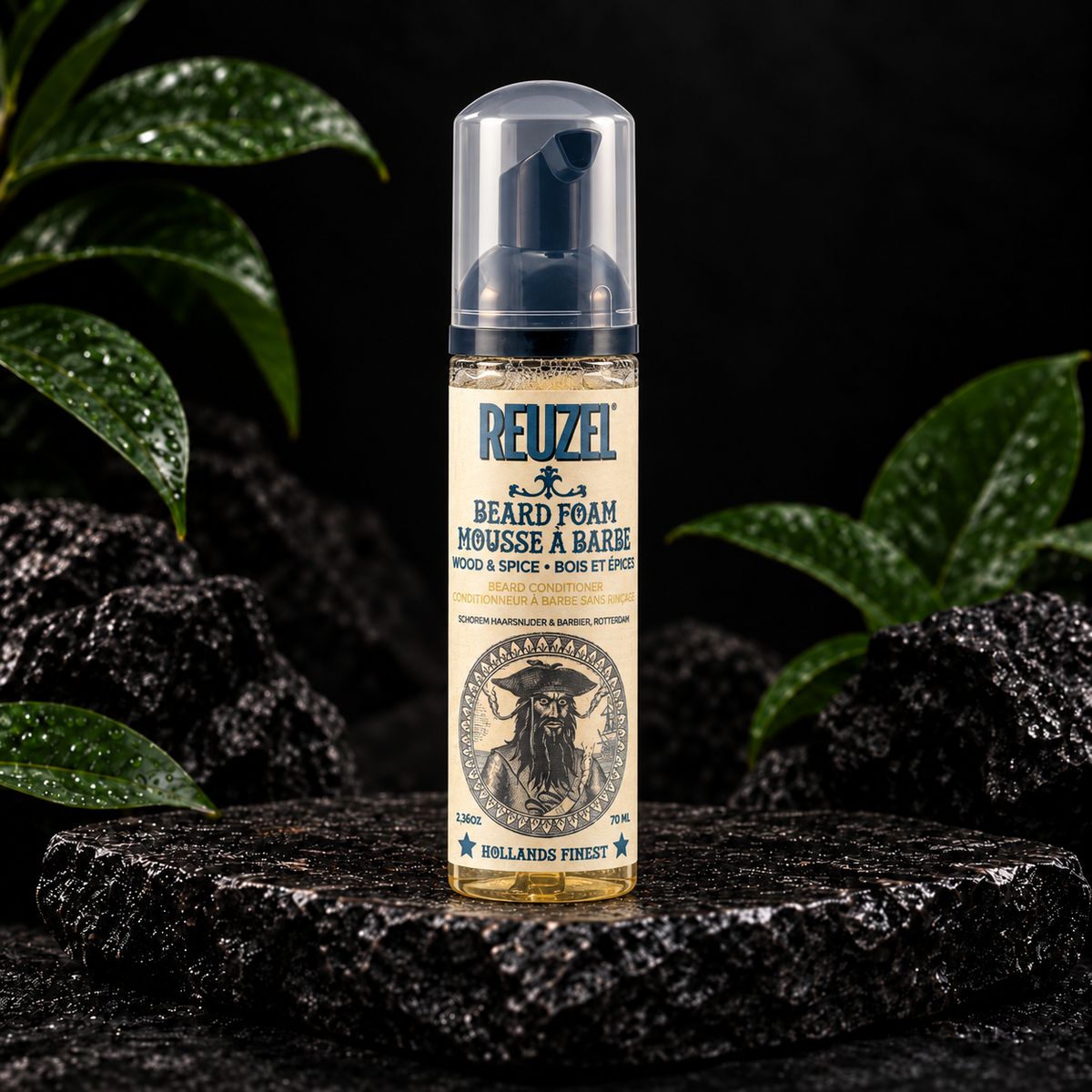 Reuzel Wood and Spice Beard Foam 70 ml on dark stone with green leaves