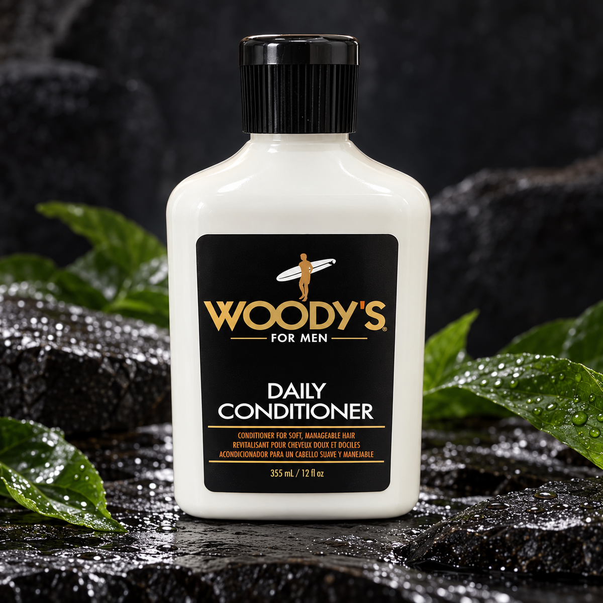Woody’s Daily Conditioner 12 fl oz bottle on dark stone with green leaves